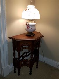 Cute carved table with electrified oil lamp