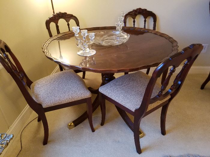 Round mahogany Henredon table with set of 4 chairs.  Glass on top is the Heisey "Orchid" console set