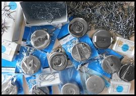 Many Retractors some with double clips plus boxes of fishing hooks.