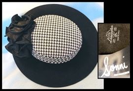 We call this the Princess Di Hat. It has the houndstooth design that we all love. Sonni by Lancaster - 100% Wool. The Bad Dog has houndstooth, too.
