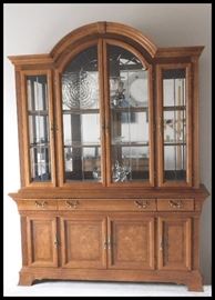 Gorgeous wooden lighted hutch (buffet) with glass shelving and mirrors. Two pieces 19" X 67" X 86" tall.