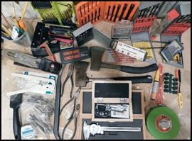 More tools including hatchets, drill bits, calipers, a wood plane and more.