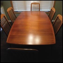 Danish modern table with six chairs.