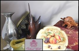Collectibles including an Aynsley bowl, ironwood carving, sculptures and frog musical instrument.