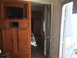 Entertainment center. TV swivels to either main living area or to Master Bd