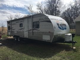 Awning extends for outdoor leisure. TV can also be mounted to exterior for outdoor use.