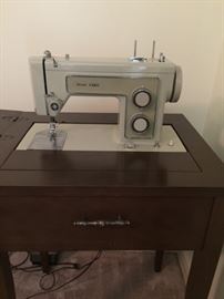 Kenmore sewing machine in cabinet