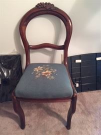 carved back chair with needlepoint seat