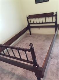 1930s hand crafted spool bed.  With extensions, it takes a 54" mattress