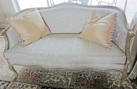 One of a matched pair of country French love seats