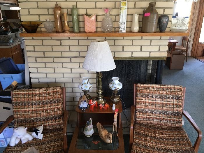 Midcentury chairs, step table, and coffee table. Oil lamps converted to electric, brass lamp