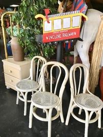 Three white parlor chairs