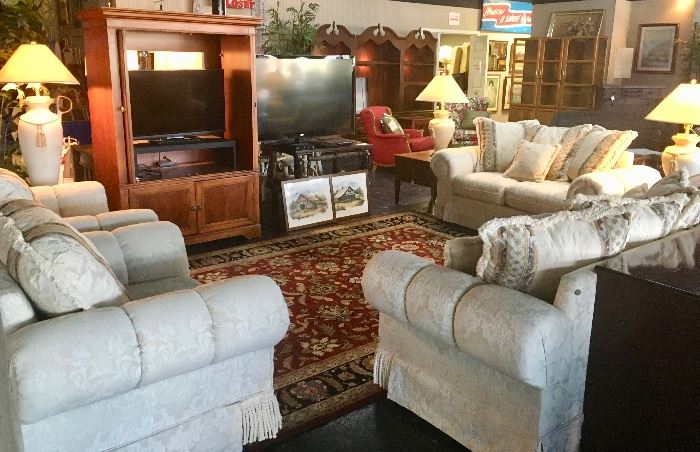4-Piece Off-White sectional...sofa, love seat, and 2 matching chairs. All have fringed bottoms.