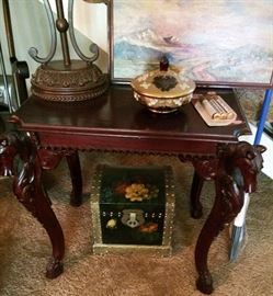 Unusual table with carved legs on of a pair