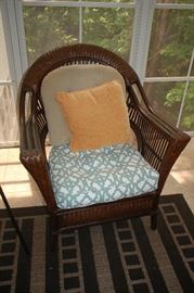 Rattan porch set, cushioned love seat, 2 arm chairs and end table
