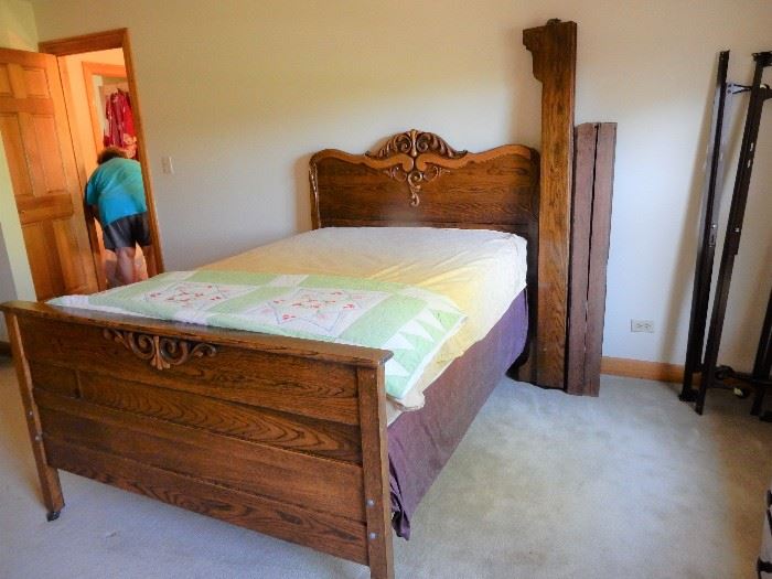 ANTIQUE OAK BED FULL SIZED HAS ORIGINAL BED RAILS AND BOARDS, SHOWN WITH A MODERN FRAME AND QUEEN MATTRESS SET