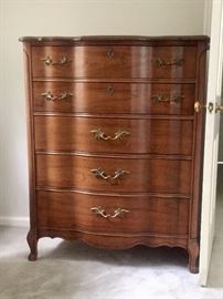 One of a pair of vintage French provincial chests of drawers