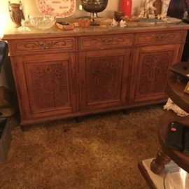 Heavily carved oak server with marble top