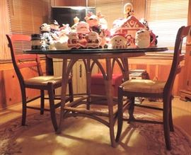 Glass Top Round Table with Rattan Base and Pottery Barn Red Chairs with Rush Seats