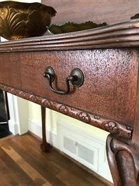 End detail of vintage Chippendale banquet table