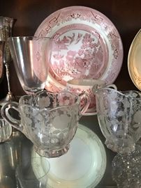 Vintage creamer and sugar in front of Churchill plates