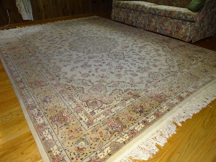 Numerous large and small throw rugs