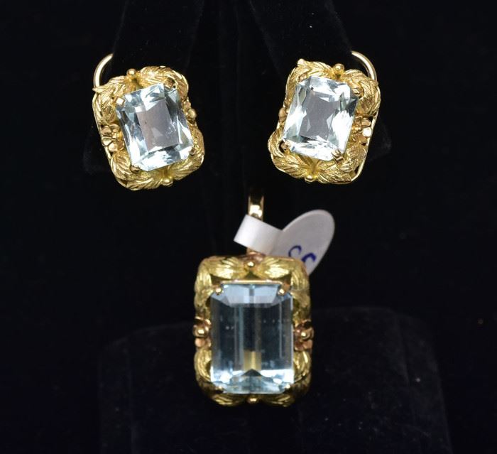 14k Gold Aquamarine Pendant and Earrings
with leaf and floral settings
pendant with 18 mm x 13 mm x 8.1 mm
stone weighing approximately 13.4 ct
the earrings set with 12 mm x 10 mm x 5.7 mm
stones each weighing approximately 4.8 ct