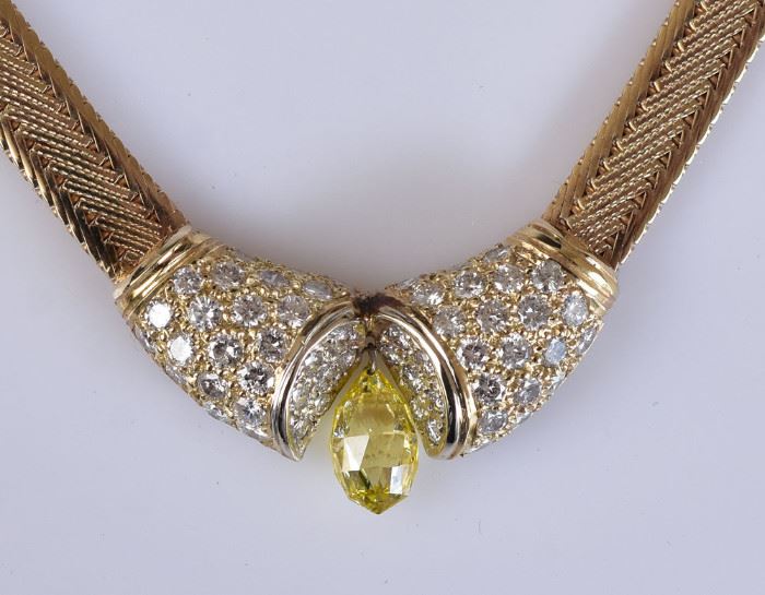 14k Gold Diamond Necklace
a central canary diamond
with 54 round brilliant cut diamonds
18" long chain, 21.1 dwt gross