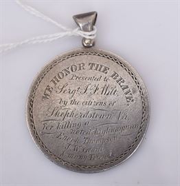 Silver Medallion
inscribed: "We Honor The Brave/ Presented
to Sergt. J.F. Hilt,/ by the citizens of
Shepherdstown, Va/ for killing a noted
highwayman/Enoch Thompson, J.W. Grant,
& many friends", 1 1/2" diameter
mid 19th century
