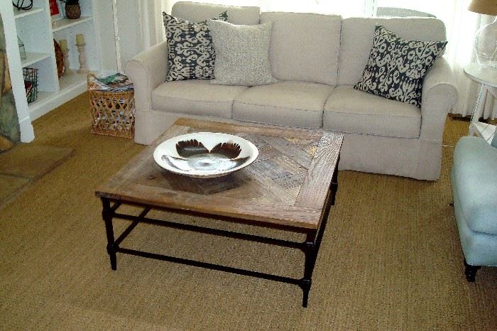 Arhaus wrought iron and wood coffee table and Baldwin 88" sofa like new with slip covers installed.