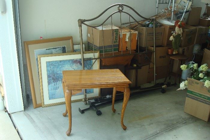 Single wrought iron bed, oak tea table, art prints and misc to be unpacked.