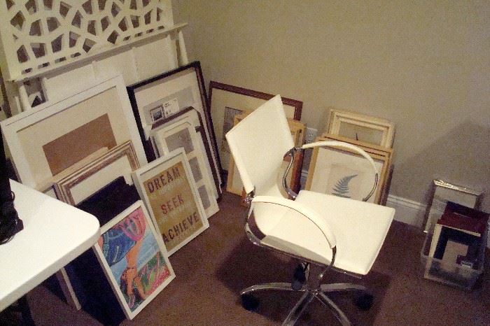Some of the art work and office chair.
