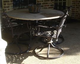 Granite top patio table and swivel chairs