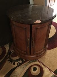 Round granite top side table with double doors