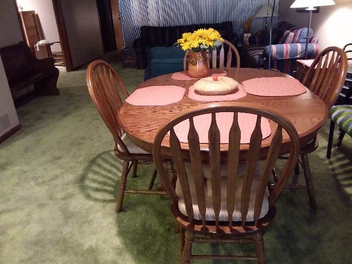 Oak pedestal table and four chairs