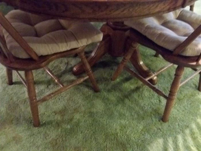 Oak pedestal table and four chairs
