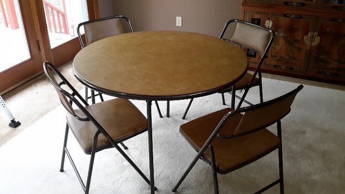 Vintage round card table and 4 folding chairs in incredible shape! 