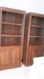 Two matching wooden bookcases.