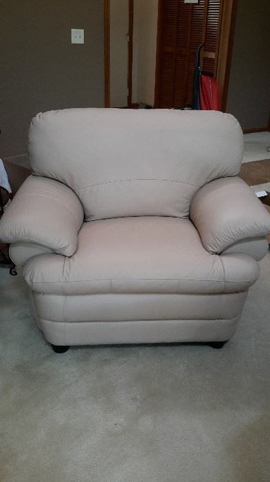 Beautiful off-white faux leather chair in like-new condition. $50.00