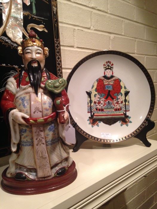 One of several Asian statues and plates
