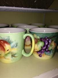 Hand painted mugs with fruit motif; artist - M.Hughes in 1970