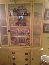 Provincial china cabinet filled with decorative "treasures"