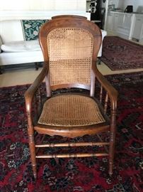 Cane turned arm chair