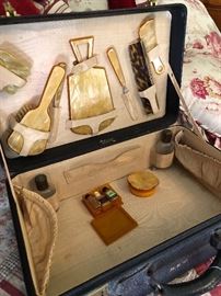 A beautiful vintage suitcase with the entire set complete