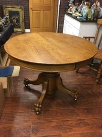 Vintage oak claw foot pedestal table; 2 leaves; 4 chairs