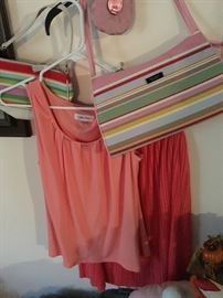 Designer women’s clothes never worn Coach bag never used still has a price tag on it and a Kate Spade spring /summer pocketbook
