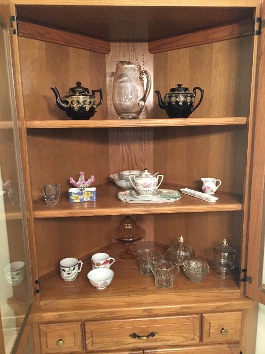 Inside of china cabinet with dishes