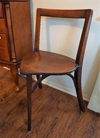 Antique three-legged chair
