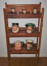 Oak bookcase with Royal Doulton Toby mugs