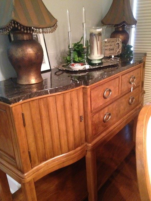 This 2-door, 3-drawer buffet has a marble top.